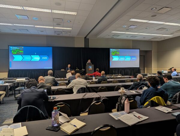 Jessica Gabb presenting to a room of people